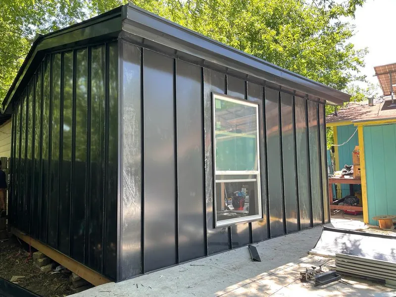 Black standing seam metal wall panels for Roof Inspection in Milton